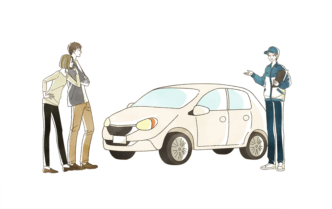 A couple of people standing next to a car.